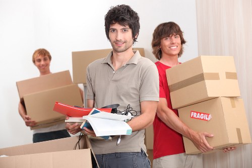 Unpacking boxes in a West Heath property after relocation