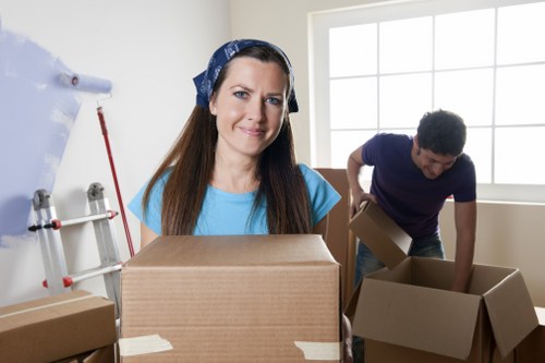 Careful packing of household items by a local moving team