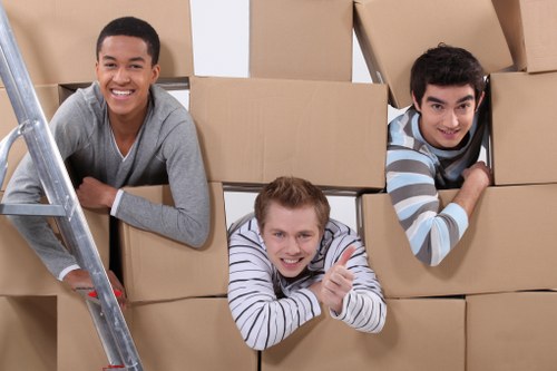 Removals crew transporting furniture from a local property