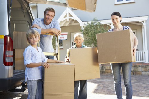 Packed boxes and furniture ready for local removal services