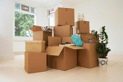 Packed boxes and home items arranged for transport by a removal van
