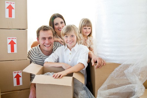 Packed boxes and moving van for removals in West Heath