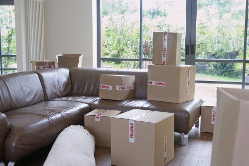 Local removals team moving household items from a West Heath property