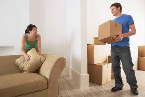 House removalists carrying items through a West Heath home entrance